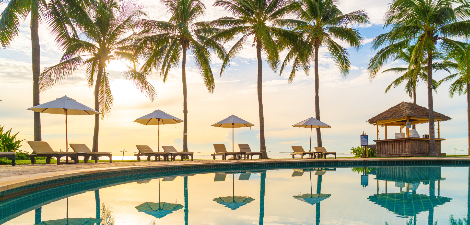 resort pool with beack in the background